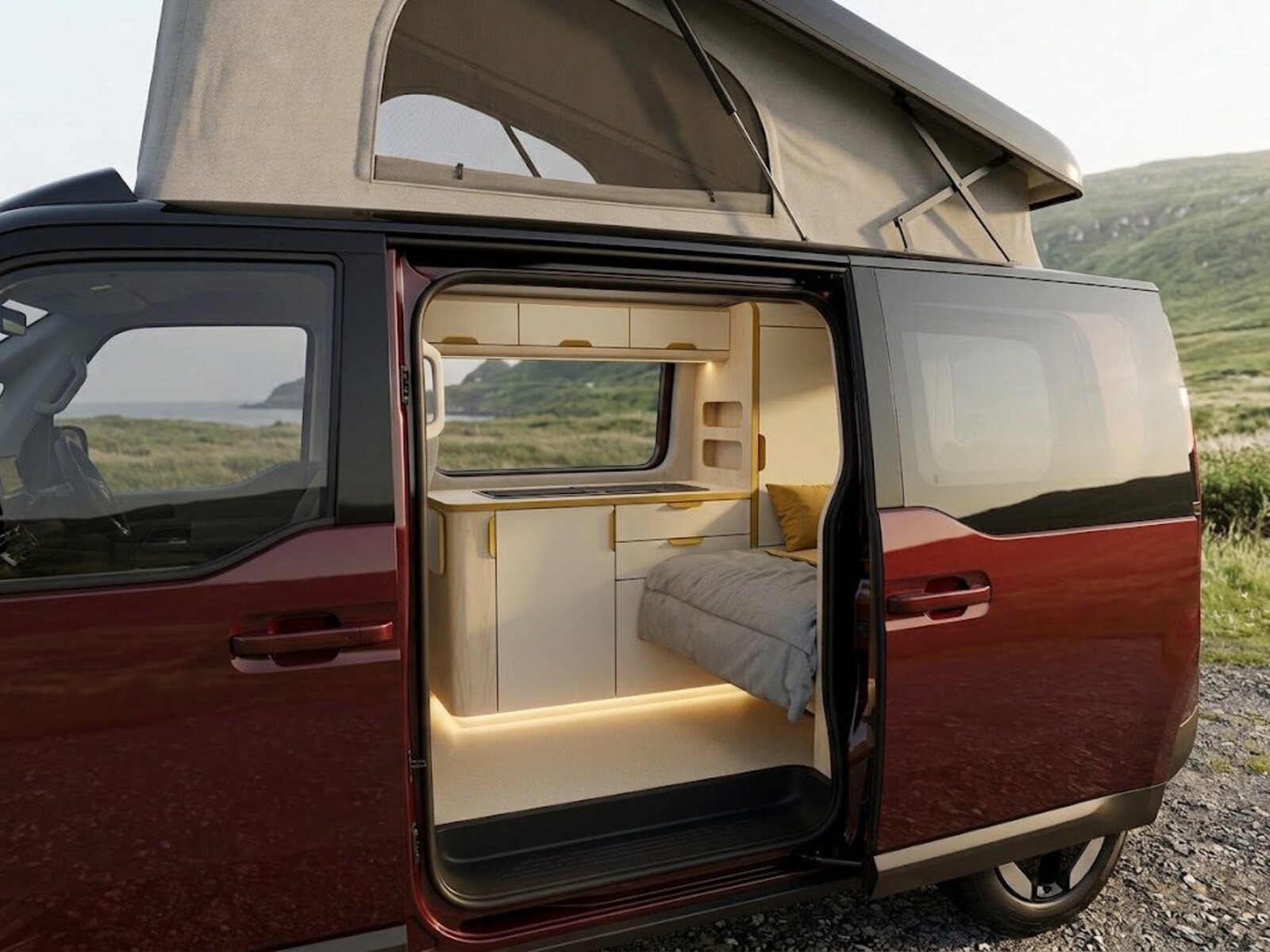 The Aurelis One with its pop-top raised and sliding door open onto the galley